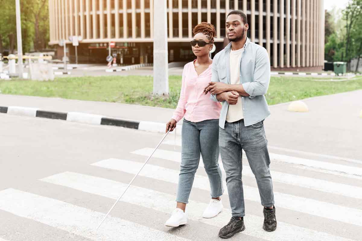 Blind couple crossing the street