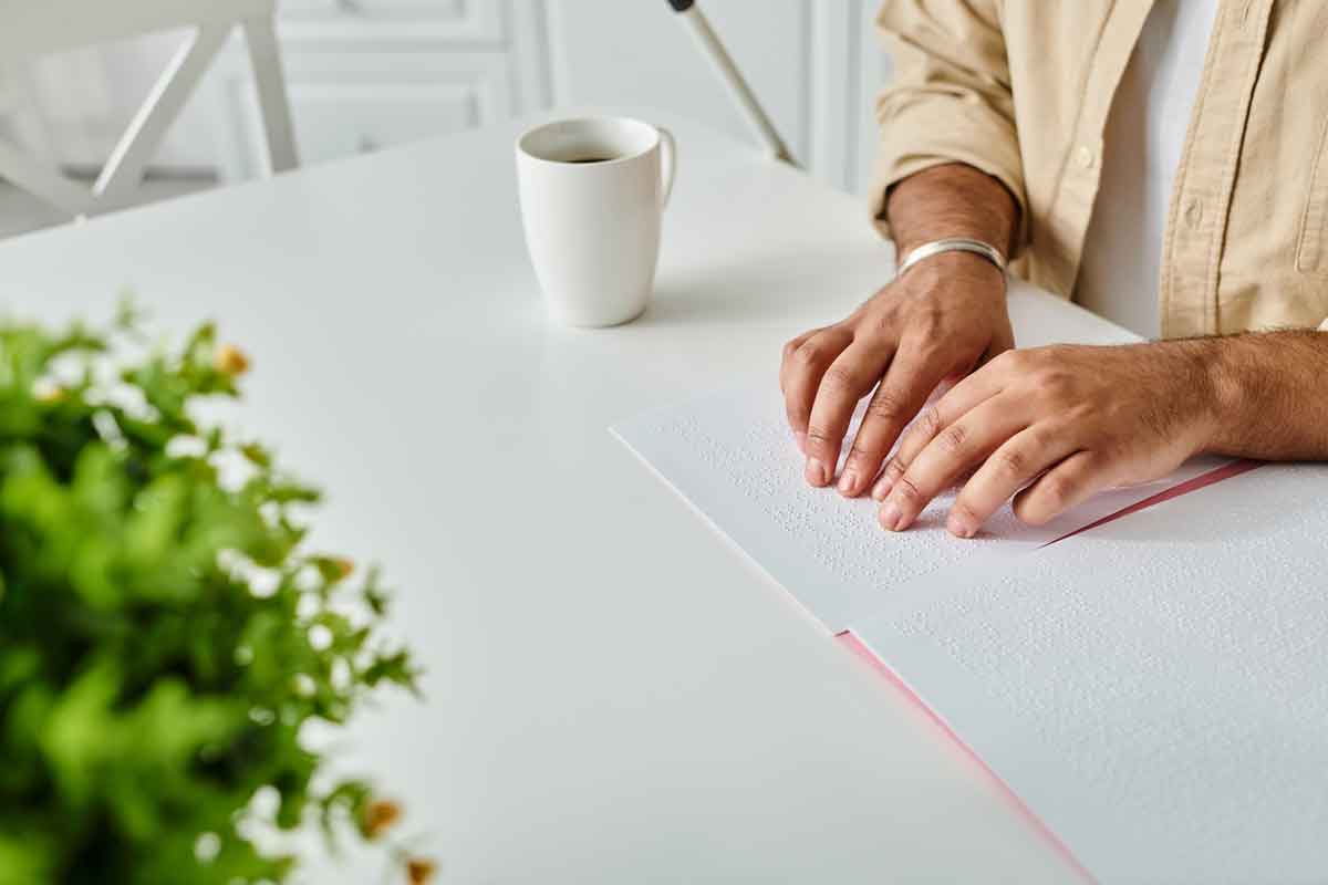 Blind person reading a book